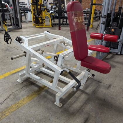 Flex leverage plate loaded shrug